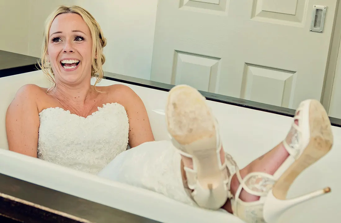 Alternative portrait of a bride in a vintage bathtub