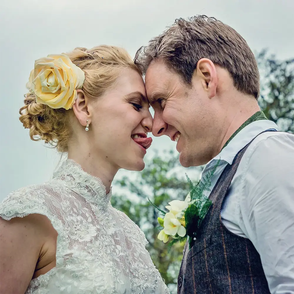 Bride and groom having fun by the River Severn after Worcester micro wedding
