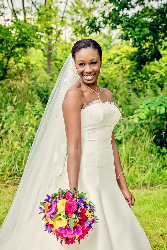 Bride holding a colourful bouquet