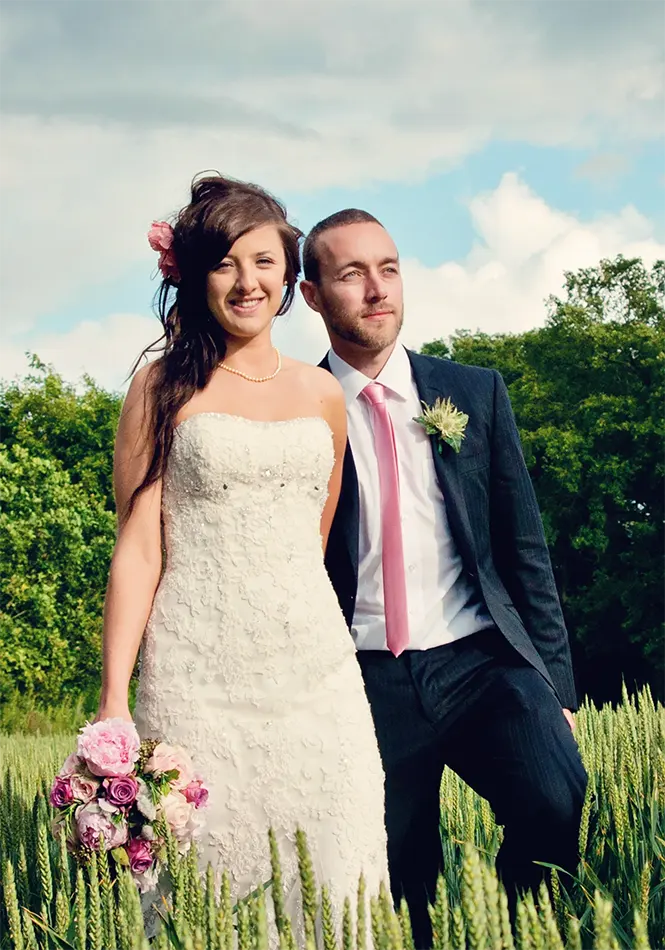 Golden hour photo of newlyweds outside countryside venue in Worcestershire