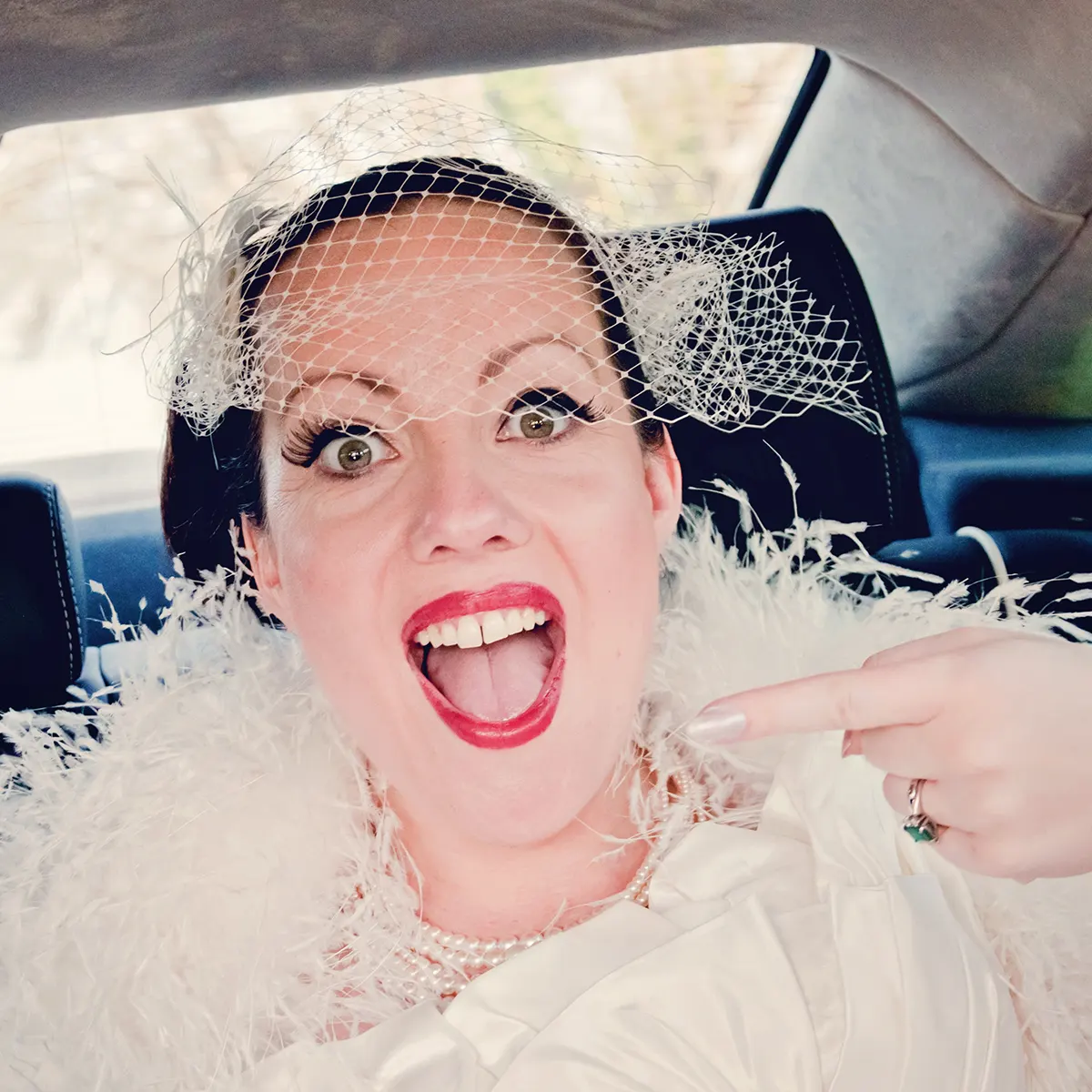 Bride laughing in her carriage outside registry office in Worcester