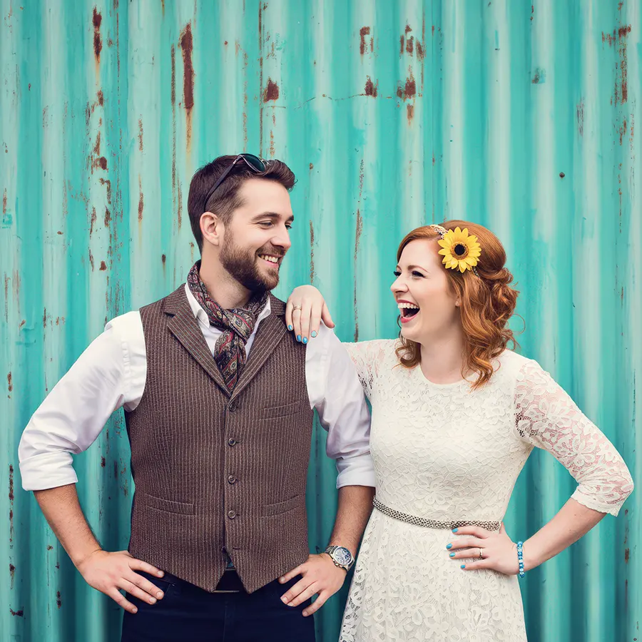 Bride and groom smiling together outside on their wedding day in Worcester
